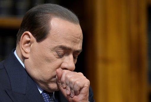 Former Italian Prime Minister Silvio Berlusconi reacts during a press conference on May 25, 2012, at the senate in Rome